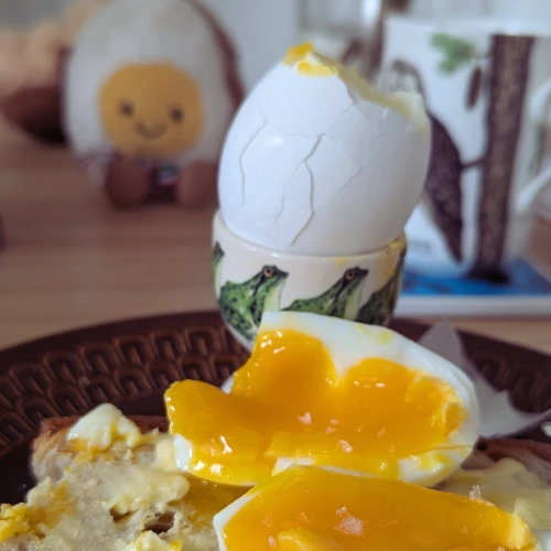 Two boiled eggs on a plate. 