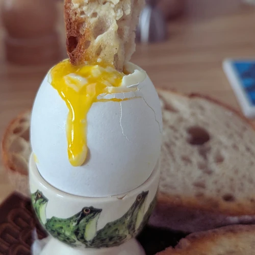 A boiled egg with yolk.